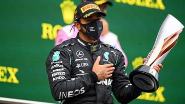 Mercedes’ British driver Lewis Hamilton celebrates on the podium after winning the Turkish Formula One Grand Prix at the Intercity Istanbul Park circuit in Istanbul on November 15, 2020. (Clive Mason/Pool/AFP)