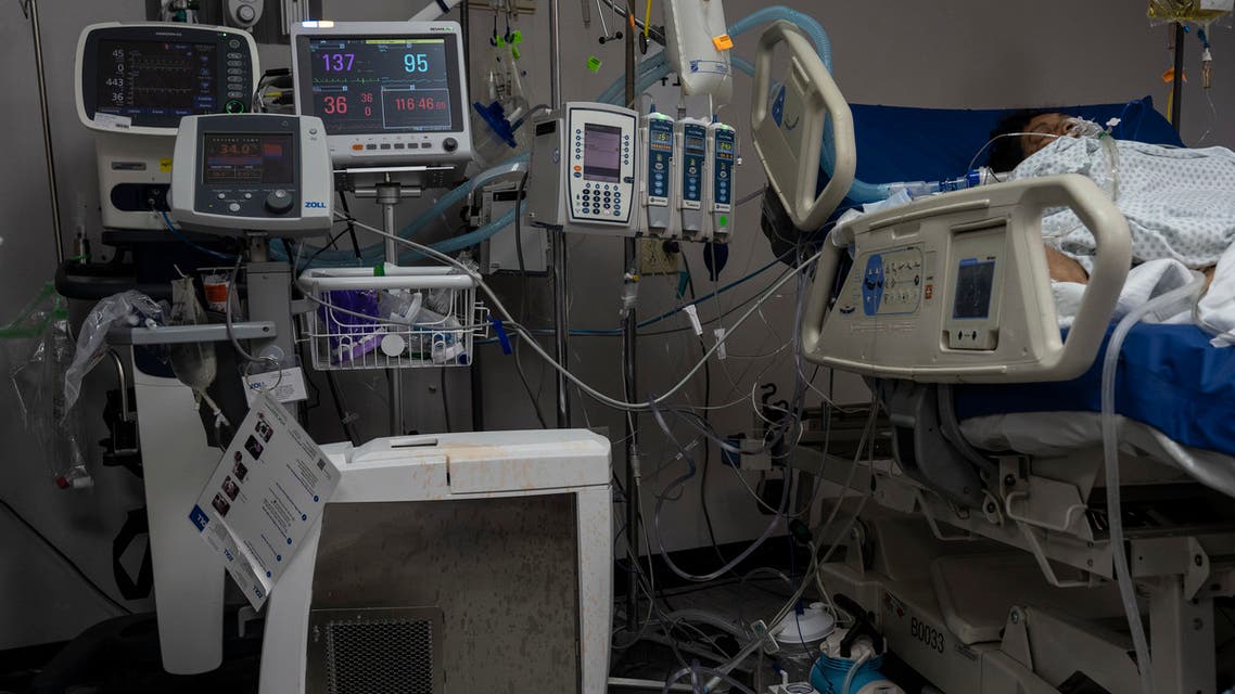 HOUSTON, TX - NOVEMBER 14: Medical staff members treat a patient suffering from the coronavirus disease (COVID-19) in the COVID-19 intensive care unit (ICU) at the United Memorial Medical Center on November 14, 2020 in Houston, Texas. According to reports, Texas has reached over 1,070,000 cases, including over 19,900 deaths. Go Nakamura/Getty Images/AFP