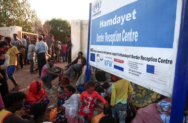 Ethiopian migrants who fled intense fighting in their homeland of Tigray, gather in the border reception center of Hamdiyet, in the eastern Sudanese state of Kasala, on November 14, 2020. (Ebrahim Hamid/ AFP)