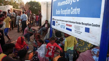 Ethiopian migrants who fled intense fighting in their homeland of Tigray, gather in the border reception center of Hamdiyet, in the eastern Sudanese state of Kasala, on November 14, 2020. (Ebrahim Hamid/ AFP)