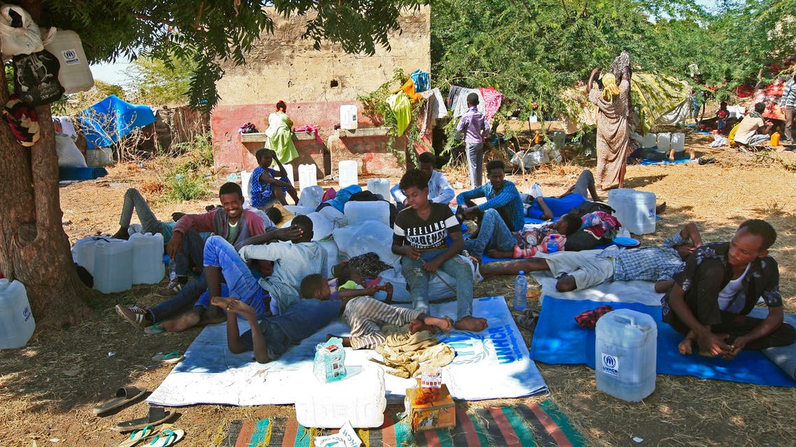 Ethiopian migrants, who fled intense fighting in their homeland, gather in the Um Raquba camp in the town of Gadaref, east of Khartoum, on November 15, 2020, after being transported from the border reception centre. Around 25,000 Ethiopians fleeing conflict in the Tigray region have crossed into neighbouring Sudan, state news agency SUNA reported, as the UN said it was working to find them shelter.