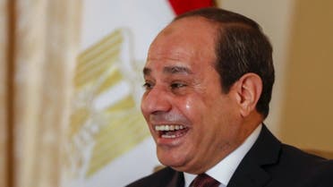 Egyptian President Abdul Fattah al-Sisi smiles prior a meeting for bi-lateral talks with US Secretary of State prior a Peace summit on Libya in Berlin on January 19, 2020. (AFP)