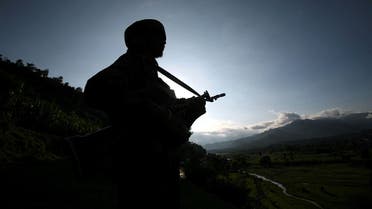A file photo shows an Indian army soldier stands guard while patrolling near the Line of Control, a ceasefire line dividing Kashmir between India and Pakistan, in Poonch district 