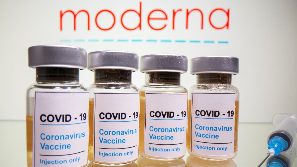 Vials with a sticker reading, COVID-19 / Coronavirus vaccine / Injection only and a medical syringe are seen in front of a displayed Moderna logo in this illustration taken October 31, 2020. (Reuters)