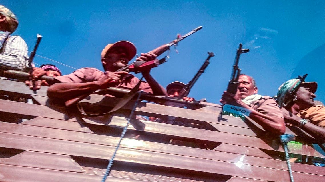 A picture taken through a car window shows Ethiopian Amhara militia fighters, that combat alongside federal and regional forces against northern region of Tigray, Gondar, Ethiopia, November 09, 2020. (Eduardo Soteras/AFP)