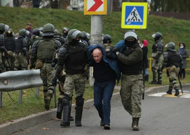 Law enforcement officers detain an opposition supporter during a rally to protest against the Belarus presidential election results in Minsk, on November 15, 2020. (Stringer/AFP)