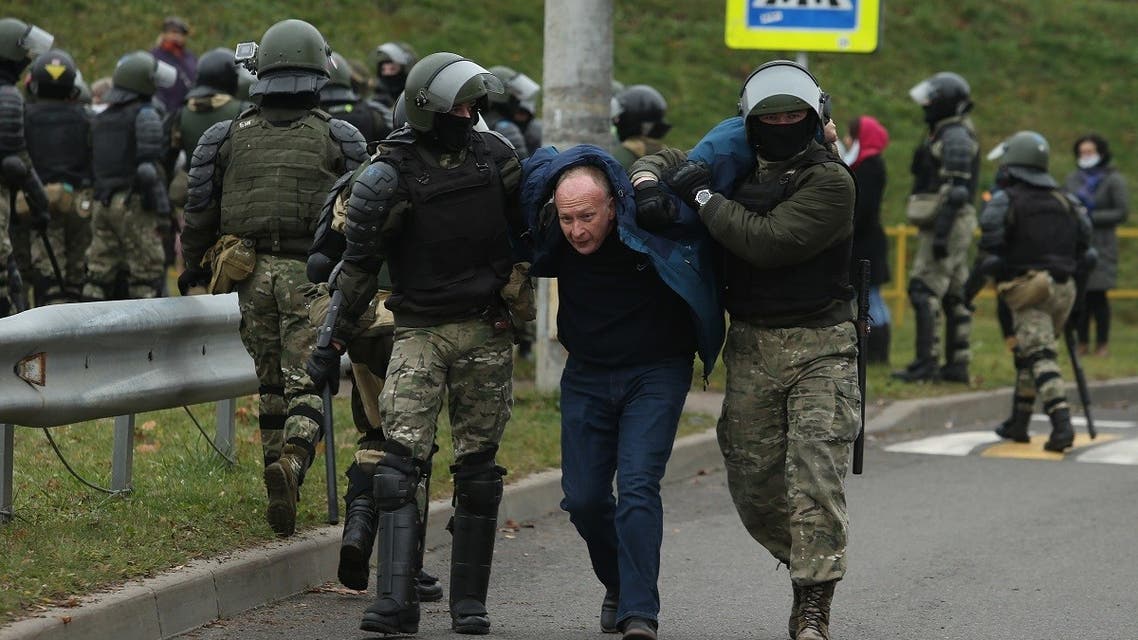 Law enforcement officers detain an opposition supporter during a rally to protest against the Belarus presidential election results in Minsk, on November 15, 2020. (Stringer/AFP)