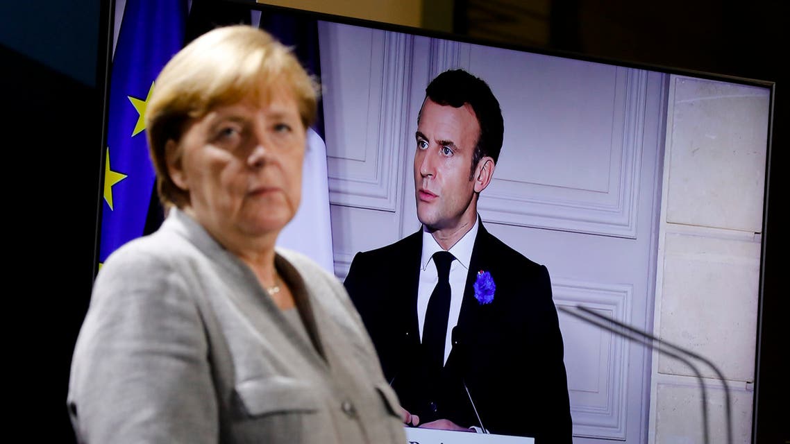 German Chancellor Angela Merkel listens to French president Emmanuel Macron, on the screen, during a virtual news conference with Austrian Chancellor Sebastian Kurz, Netherlands Prime Minister Mark Rutte, European Commission President Ursula von der Leyen and European Council President Charles Michel at the chancellery in Berlin, Germany, Tuesday, Nov. 10, 2020. The news conference following on a virtual meeting about terrorism in Europe. (AP Photo/Markus Schreiber, pool)