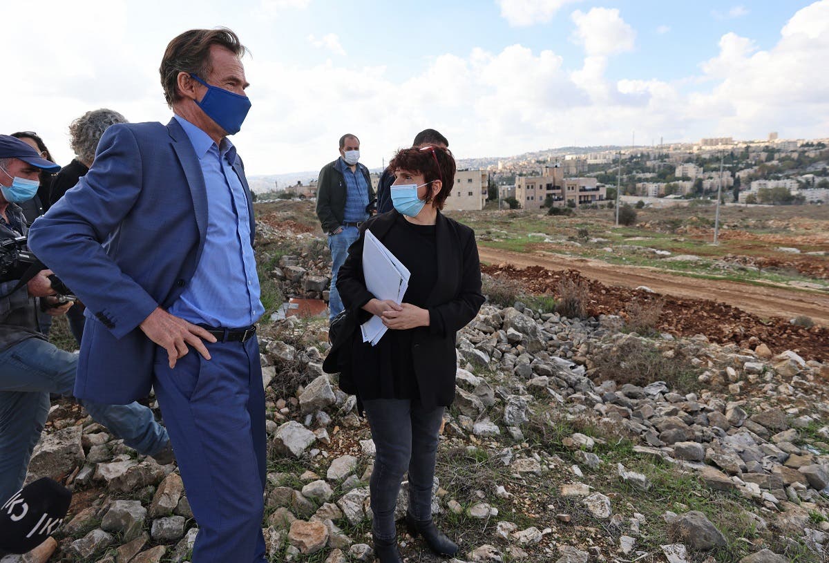 EU representative in the Palestinian territories Sven Kuhn von Burgsdorff (C) tours the site of a planned extension of the Givat Hamatos ISRAELI settlement in east Jerusalem on November 16, 2020. (Emmanuel Dunand/AFP)