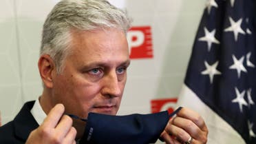 FILE PHOTO: U.S. National Security Advisor Robert O'Brien takes off his a face mask during a meeting at Sao Paulo's Industries Federation President in Sao Paulo, Brazil October 19, 2020. REUTERS/Amanda Perobelli/File Photo
