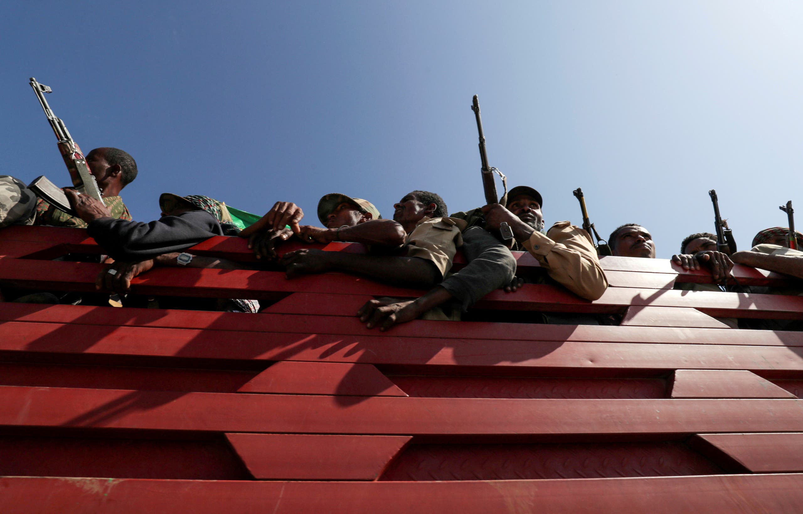 Militia members from Ethiopia's Amhara region ride on their truck as they head to face the Tigray People's Liberation Front (TPLF), in Sanja, Amhara region near a border with Tigray, Ethiopia, November 9, 2020. (Reuters)