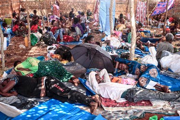 Ethiopian refugees who fled fighting in Tigray province lay in a hut at the Um Rakuba camp in Sudan's eastern Gedaref province, on November 16, 2020. (Ebrahim Hamid/AFP)