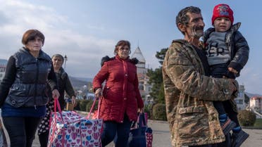 Refugees are seen upon their arrival from Yerevan, on November 17, 2020 in Stepanakert. (AFP)