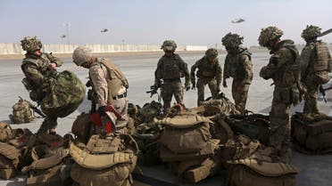 British soldiers arrive at Kandahar air base at the end of operations for U.S. Marines and British combat troops in Helmand. (reuters)