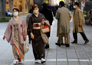 Women wearing Kimono and protective masks, following the coronavirus disease (COVID-19) outbreak, walk in Tokyo, Japan November 13, 2020. (Reuters)