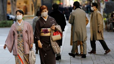 Women wearing Kimono and protective masks, following the coronavirus disease (COVID-19) outbreak, walk in Tokyo, Japan November 13, 2020. (Reuters)