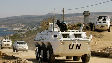 United Nations Interim Force in Lebanon (UNIFIL) vehicles patrol the Lebanese-Israeli border near the village of Ras al-Naqura on December 16, 2013 following crossfire between Israeli and Lebanese forces the previous evening. The Israeli army said it fired across the Lebanese border in retaliation after accusing Lebanese troops of gunning down one of its soldiers as he drove near the frontier. AFP PHOTO / MAHMOUD ZAYYAT