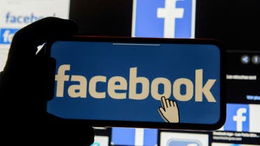 The Facebook logo is displayed on a mobile phone in this picture illustration taken December 2, 2019. (Reuters)