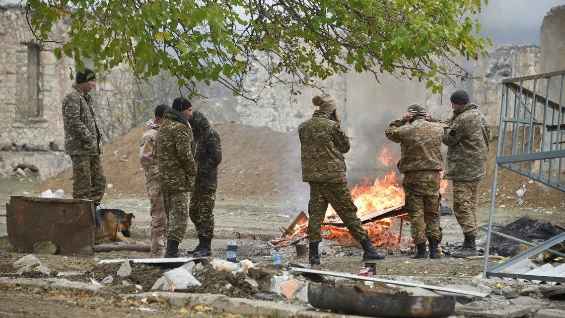 Armenian soldiers evacuate their headquarters from the town of Agdam on Nov. 19, 2020 as the territory is due to be returned to Azerbaijan on November 20, 2020. (AFP)