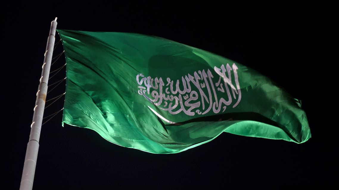 The Saudi national flag flutters at the historical site of al-Tarif in Diriyah district, on the outskirts of Saudi capital Riyadh, on November 20, 2020. Saudi Arabia hosts the G20 summit on November 21 in a first for an Arab nation, with the downsized virtual forum dominated by efforts to tackle a resurgent coronavirus pandemic and crippling economic crisis.