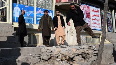 Residents gather at a site after several rockets land at Khair Khana, north west of Kabul on November 21, 2020. (Wakil Kohsar/AFP)