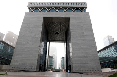 People walk near The Gate building at the financial and business district Dubai International Financial Center (DIFC) in Dubai, February 2, 2012. (Reuters/Jumana El Heloueh) 