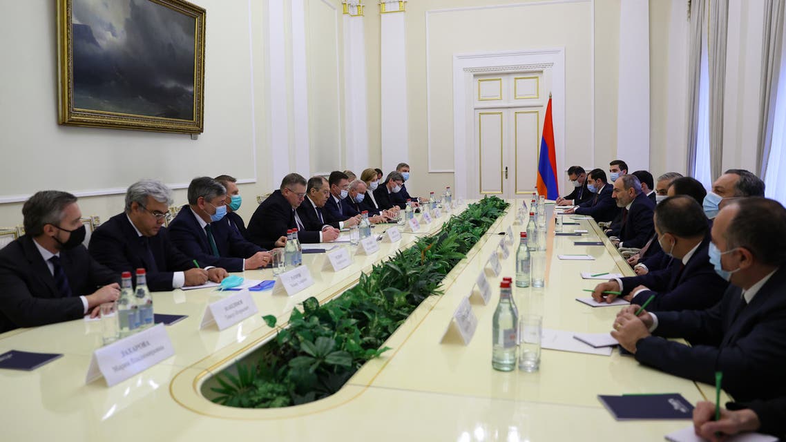This handout photograph taken and released on November 21, 2020 by the Russian Foreign Ministry shows Armenian Prime Minister Nikol Pashinyan (R) as he meets with Russian Foreign Minister Sergei Lavrov (L) in Yerevan.