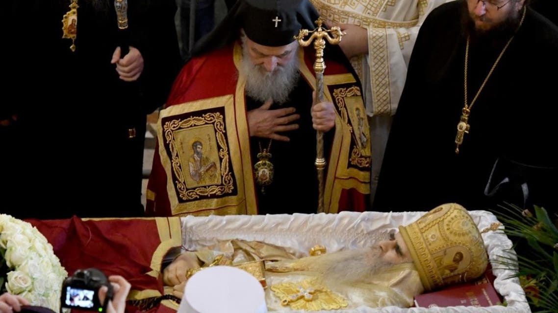 This file photograph taken on November 1, 2020, shows The Patriarch of the Serbian Orthodox Church, Irinej (C), during the funeral service of Metropolitan Amfilohije Radovic, the top cleric of the Serbian Orthodox Church in Podgorica, Montenegro. (AFP)