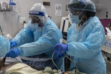 Medical staff members prepare for an intubation procedure on a patient suffering from the coronavirus disease (COVID-19) in the COVID-19 intensive care unit (ICU) at the United Memorial Medical Center on November 19, 2020 in Houston, Texas. (AFP)