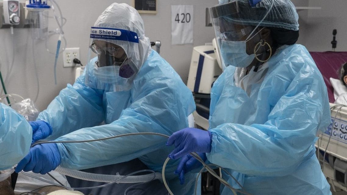 Medical staff members prepare for an intubation procedure on a patient suffering from the coronavirus disease (COVID-19) in the COVID-19 intensive care unit (ICU) at the United Memorial Medical Center on November 19, 2020 in Houston, Texas. (AFP)
