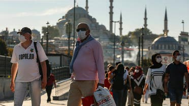 People, wearing masks to help protect against the spread of coronavirus, walk in Istanbul on Oct. 2, 2020. (File photo: AP)