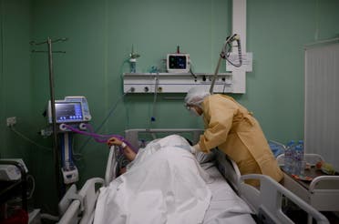 A patient receives medical assistance in a temporary intensive care unit inside a pavilion of the Exhibition of Achievements of National Economy (VDNH) in Moscow, Russia on November 17, 2020. (Reuters)
