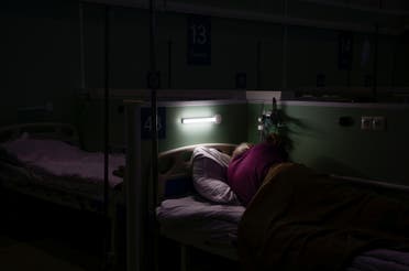 A patient is seen at the temporary hospital inside one of pavilions of Exhibition of Achievements of National Economy (VDNH), in Moscow, Russia November 17, 2020. (Reuters)
