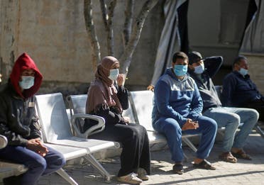 Palestinians wearing protective face masks sit at Shifa hospital amid the coronavirus disease (COVID-19) outbreak, in Gaza City November 22, 2020. (File photo: Reuters)