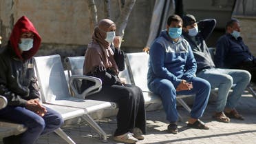Palestinians wearing protective face masks sit at Shifa hospital amid the coronavirus disease (COVID-19) outbreak, in Gaza City November 22, 2020. (Reuters/Mohammed Salem)