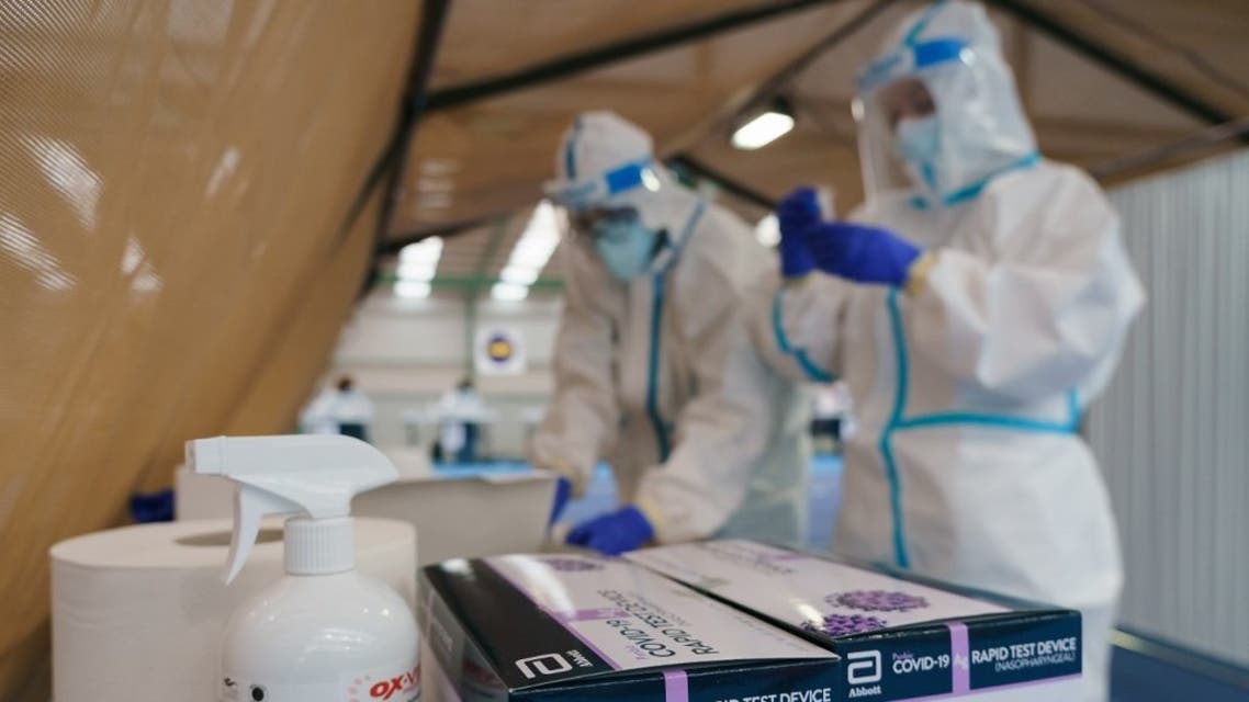 Health personnel conduct antigen rapid tests for COVID-19 during a mass screening for coronavirus to test 25 percent of the population in Burgos, northern Spain, on November 21, 2020. (AFP)