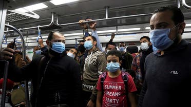 People wearing protective face masks stand inside a train at a metro station in Cairo, Egypt November 21, 2020. (Reuters/Mohamed Abd el-Ghany)