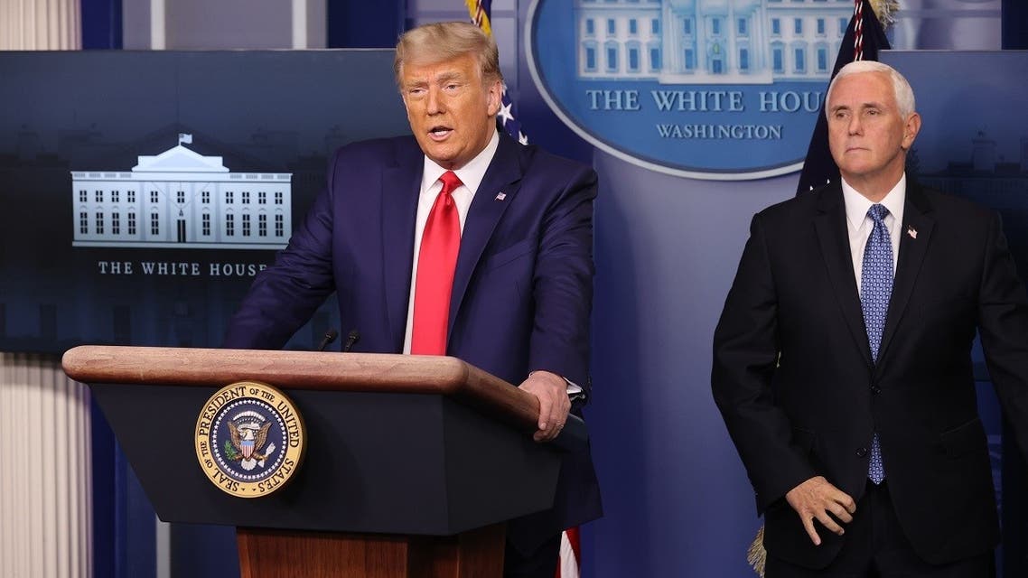 US President Donald Trump speaks as VP Mike Pence looks on at the White House, Nov. 24, 2020. (AFP)