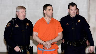 Scott Peterson is escorted by two San Mateo County Sheriff deputies as he is walked from the jail to a waiting van in Redwood City, California, March 17, 2015. (AP)