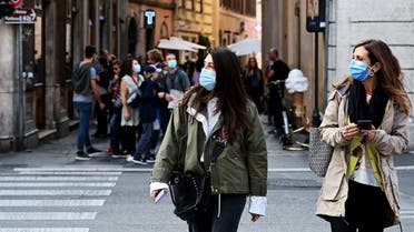 Women walk in downtown Rome, on October 25, 2020, as the country faces a second wave of infections to the coronavirus. (Vincenzo Pinto/AFP)