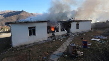 A view shows a house on fire in Karvatchar town in the region of Nagorno-Karabakh, November 24, 2020. The recent signing of a ceasefire deal ended a military conflict between Azerbaijan's troops and ethnic Armenian forces in the region. Picture taken November 24, 2020. Hayk Baghdasaryan/Photolure via REUTERS ATTENTION EDITORS - THIS IMAGE HAS BEEN SUPPLIED BY A THIRD PARTY