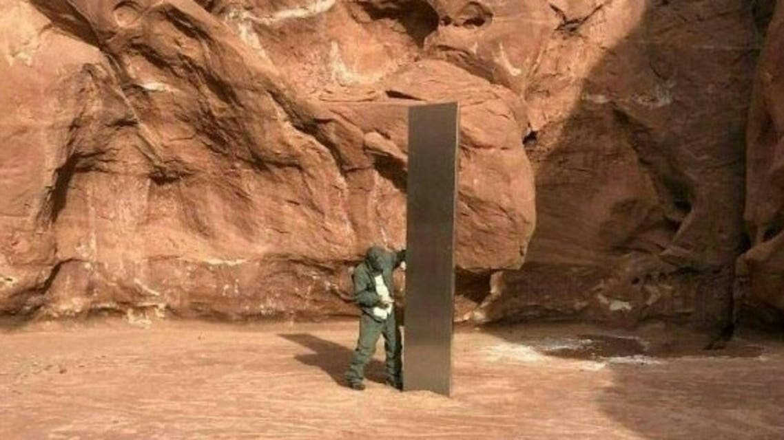 This video grab image obtained November 24, 2020 courtesy of the Utah Department of Public Safety Aero Bureau shows a mysterious metal monolith that was discovered in Utah after public safety officers spotted the object while conducting a routine wildlife mission. (AFP)