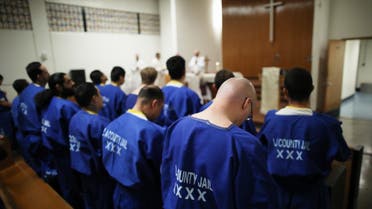 Inmates worship during Christmas Mass led by Archbishop Jose H. Gomez in a chapel at Men's Central Jail on December 25, 2019 in Los Angeles, California. (AFP)