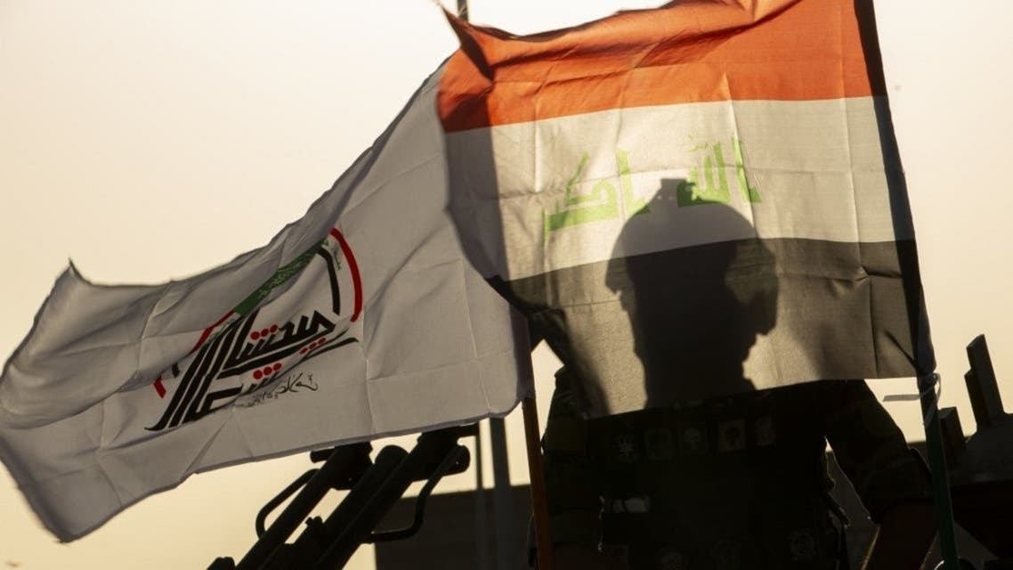 Members of the Hashed al-Shaabi (Popular Mobilisation) paramilitary force take part in a military parade in the southern Iraqi city of Basra on June 14, 2020. (AFP)