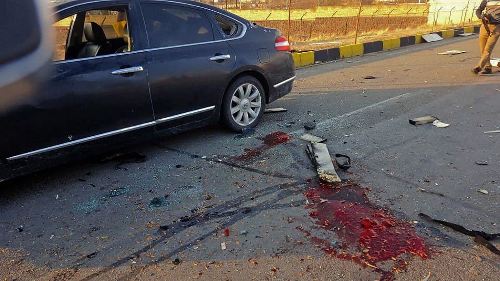 A handout photo made available by Iran state TV (IRIB) on November 27, 2020, shows the damaged car of Iranian nuclear scientist Mohsen Fakhrizadeh after it was attacked near the capital Tehran. (AFP)