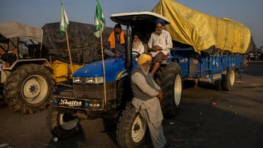 Farmers sit in a tractor at a site of a protest against the newly passed farm bills at Singhu border near Delhi, India, November 28, 2020. (Reuters)