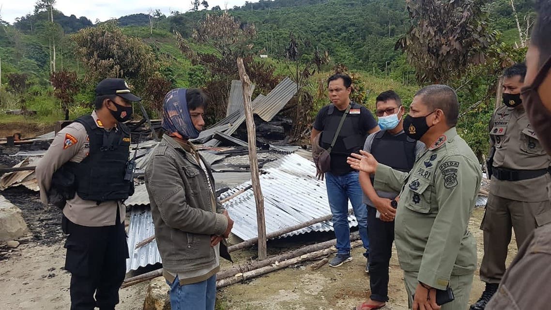 Police officers inspecting the site of an attack, believed to be by ISIS-linked extremists, that killed four people in a remote Christian community of Lembantongoa village, in Palu on the Indonesian island of Sulawesi. (Central Sulawesi Province Police/AFP)