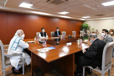 India’s PM Narendra Modi (L) chairing a meeting during his visit to the Serum Institute of India to review the coronavirus vaccine development, in Pune, November 28, 2020. (AFP)