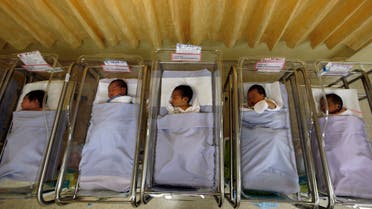 Babies lie in cots at a maternity ward in Singapore. (File photo: Reuters)