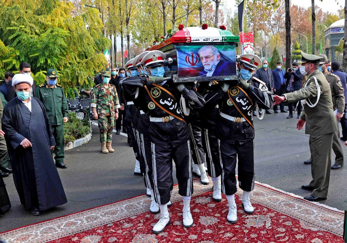 A handout picture provided by Iran’s Defesce Ministry on November 30, 2020 shows members of Iranian forces carrying the coffin of slain top nuclear scientist Mohsen Fakhrizadeh during his funeral ceremony in Iran’s capital Tehran. (AFP)